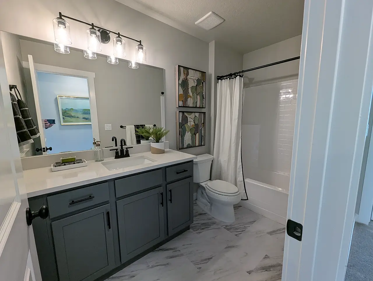 0211693 Utah Basement Finishing- Bathroom with a dark vanity
