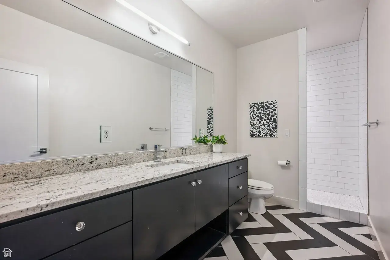 09161044 Orem Utah Basement Bathroom with a double sink vanity